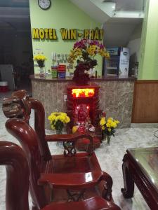 a salon with a rocking chair and a fire place at MOTEL WIN - PHÁT in Bien Hoa