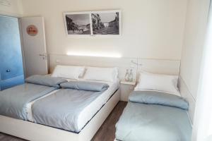 Postel nebo postele na pokoji v ubytování Albergo Cristina