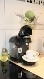 Kuchyň nebo kuchyňský kout v ubytování Apartmán - Café Princ pod Hradem WiFi, KLIMA