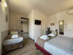 A bed or beds in a room at Porta alla Croce Guest House