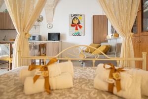 a bedroom with a bed with two white pillows at CASETTA CLOE house of charm and romance in Ceglie Messapica