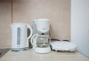 two white appliances are sitting on a counter at Kalami apartment in Falasarna in Falasarna