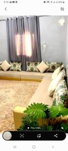a living room with a couch with pillows at Apartment Ami in Nouakchott