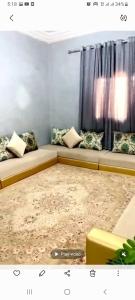 a living room with a couch with pillows at Apartment Ami in Nouakchott