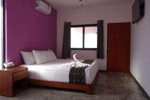 Postel nebo postele na pokoji v ubytování Itza Hotel Akumal