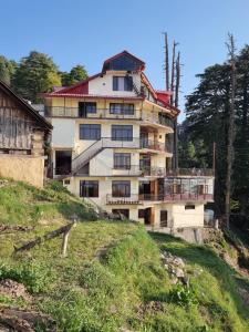 a building on the side of a hill at Smart Valley Dalhousie in Dalhousie
