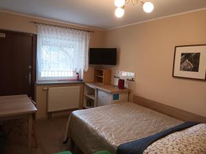 Postel nebo postele na pokoji v ubytování Apartamenty i pokoje u Kryni