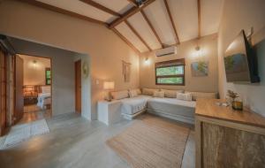 a large living room with a couch and a bed at ICACO refugio de playa in Guachaca