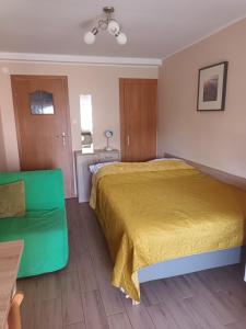 Postel nebo postele na pokoji v ubytování Apartamenty i pokoje u Kryni