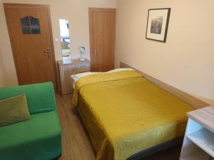 Postel nebo postele na pokoji v ubytování Apartamenty i pokoje u Kryni