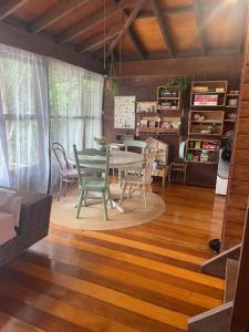 a dining room with a table and chairs at “Jinwhi” in Beechmont +9 photos