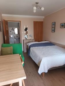 Postel nebo postele na pokoji v ubytování Apartamenty i pokoje u Kryni