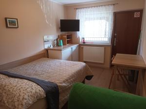 Postel nebo postele na pokoji v ubytování Apartamenty i pokoje u Kryni
