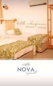 Postel nebo postele na pokoji v ubytování Nova Aparts