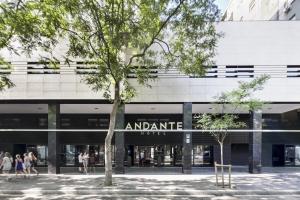 a large building with a large group of people in front of it at Andante Hotel in Barcelona