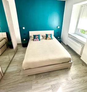 a bedroom with a bed with pillows on it at TIME TO ESCAPE 2 in Tirano