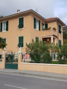 a house with a gate and a fence at Bibi a Mare in Finale Ligure