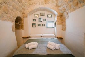 Katil atau katil-katil dalam bilik di Trulli Pinacea