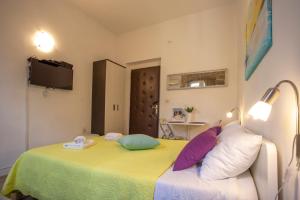 a bedroom with a bed with pillows on it at Old Town Historic Core in Split