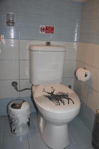 a bathroom with a toilet with a lizard painted on it at Apartment Patra Greece in Patra