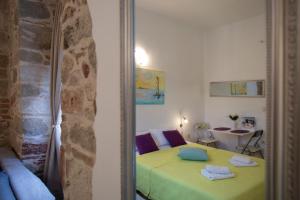 a reflection of a bedroom with a bed in a mirror at Old Town Historic Core in Split
