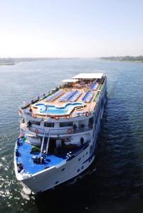 a large cruise ship in a large body of water at Kiara Nile Cruise every Saturday, Monday and Thursday from Luxor in Jazīrat al ‘Awwāmīyah