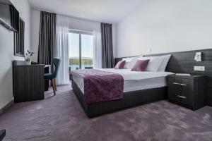 Postel nebo postele na pokoji v ubytování Hotel Novum