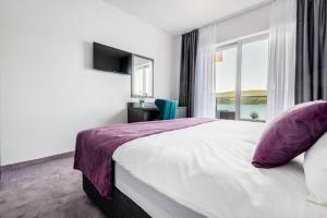 Postel nebo postele na pokoji v ubytování Hotel Novum
