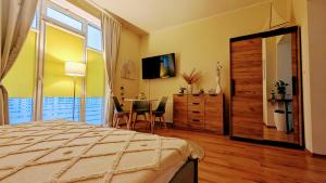Telewizja i/lub zestaw kina domowego w obiekcie Studio Appartment Heinze