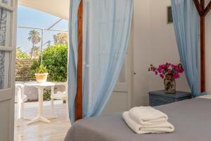 A bed or beds in a room at Irene Hotel Leros