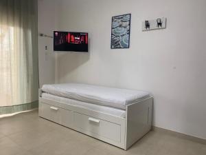 Postel nebo postele na pokoji v ubytování Vitti Apartment