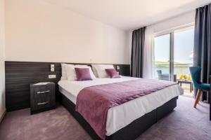 Postel nebo postele na pokoji v ubytování Hotel Novum