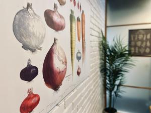 a wall with onions hanging on a wall at Court Hotel Shin-Yokohama in Yokohama