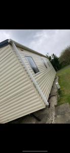 a house with a roof on top of it at Blue Beach Retreats Ltd in Mablethorpe