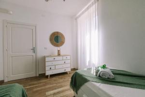 Postel nebo postele na pokoji v ubytování Ad un passo dal molo
