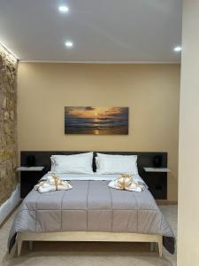 Postel nebo postele na pokoji v ubytování KALGHEROS Luxury Rooms