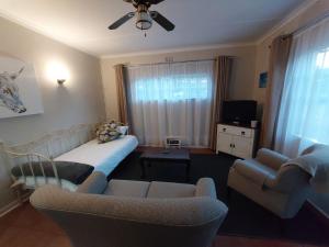 Postel nebo postele na pokoji v ubytování Coral Cottage