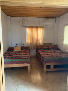 Postel nebo postele na pokoji v ubytování Cabaña El Esplendor + 30 fotografií