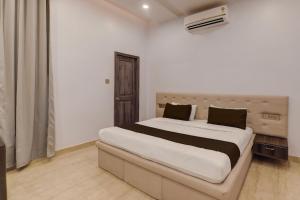 Katil atau katil-katil dalam bilik di OYO Flagship Paradise Villa 1