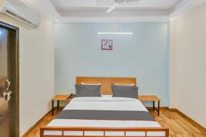 Postel nebo postele na pokoji v ubytování Capital O Moody Inn