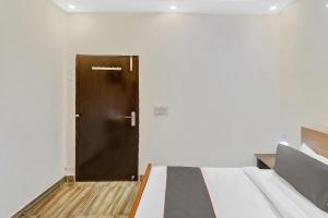 Postel nebo postele na pokoji v ubytování Capital O Moody Inn