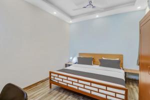 Postel nebo postele na pokoji v ubytování Capital O Moody Inn