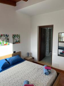 a bedroom with a bed and a large mirror at Villa Alelida in Cinisi +13 photos