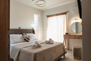 Postel nebo postele na pokoji v ubytování Elite Luxury Residences