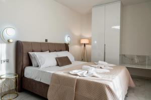 Postel nebo postele na pokoji v ubytování Elite Luxury Residences