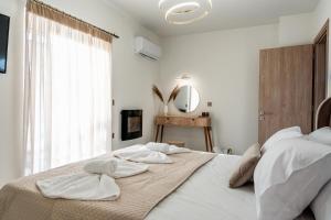 Postel nebo postele na pokoji v ubytování Elite Luxury Residences + 17 fotografií