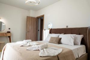Postel nebo postele na pokoji v ubytování Elite Luxury Residences
