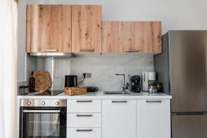 Kuchyň nebo kuchyňský kout v ubytování Elite Luxury Residences