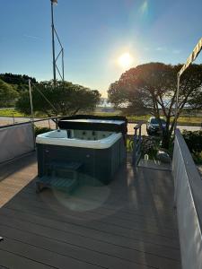 a hot tub sitting on top of a deck at Sunset Joy in Portorož