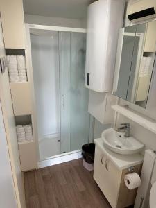 a bathroom with a shower and a sink at Sunset Joy in Portorož